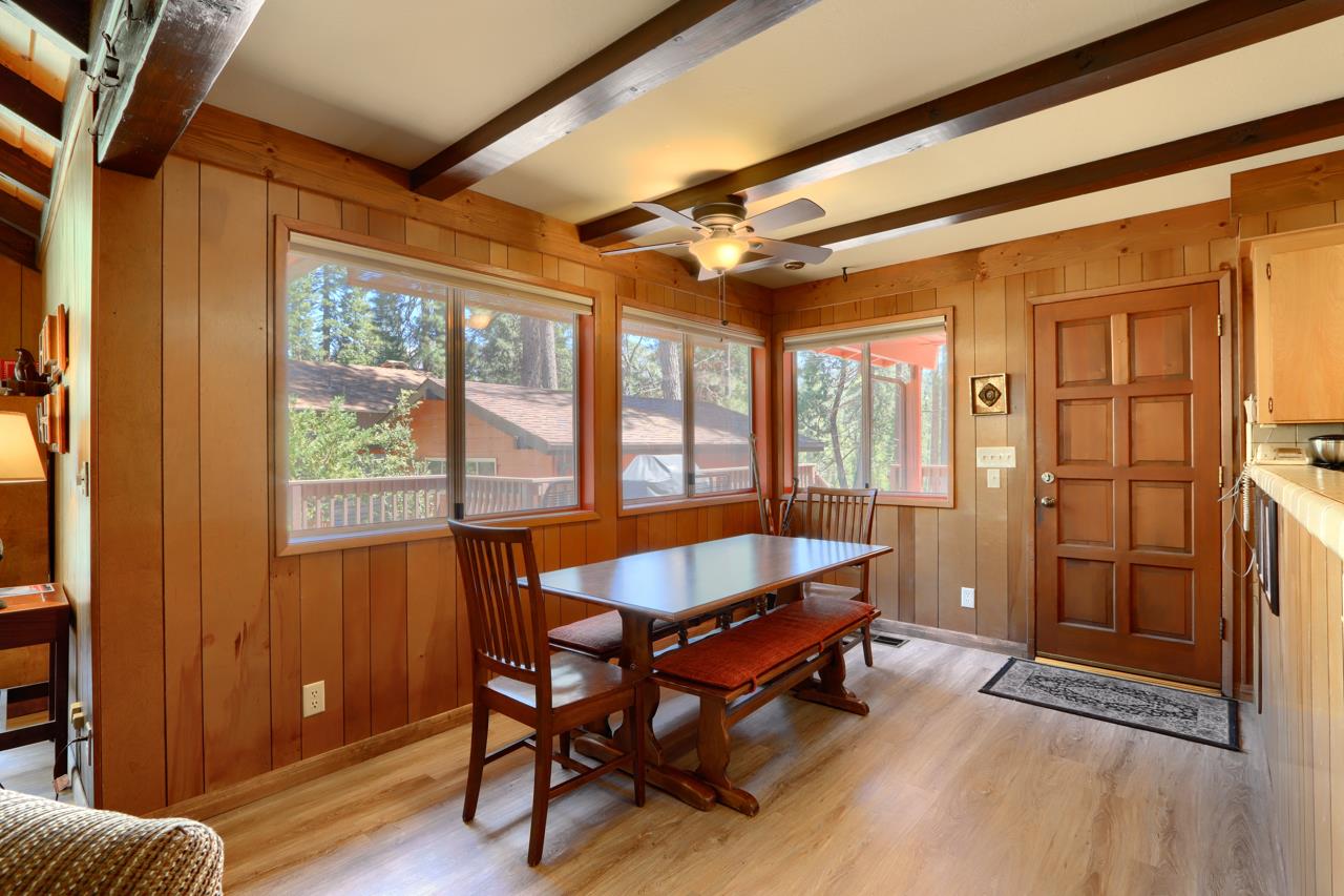 8067 Chilnualna Falls Road Wawona, CA 95389 - Photo 11 of 42 a dining room with furniture and wooden floor
