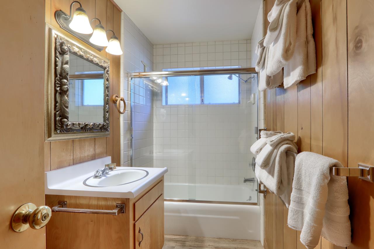 8067 Chilnualna Falls Road Wawona, CA 95389 - Photo 19 of 42 a bathroom with a sink a mirror and a bathtub