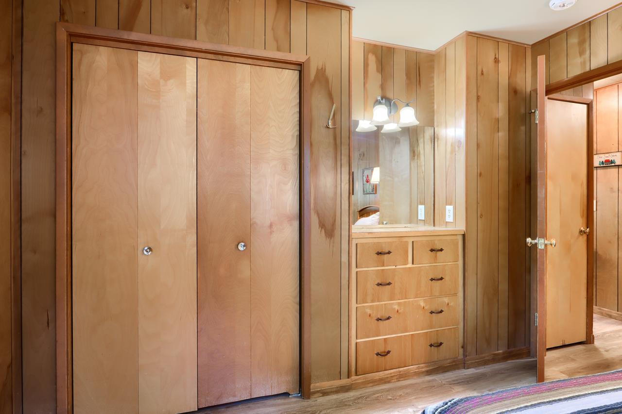 8067 Chilnualna Falls Road Wawona, CA 95389 - Photo 26 of 42 a bathroom with a glass shower door and a mirror