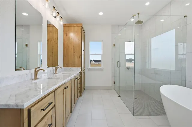 a bathroom with a granite countertop sink a toilet a mirror and shower