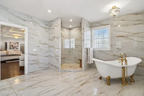 a bathroom with a sink shower and a bathtub