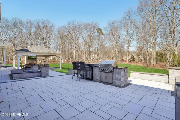 a view of a patio with a yard
