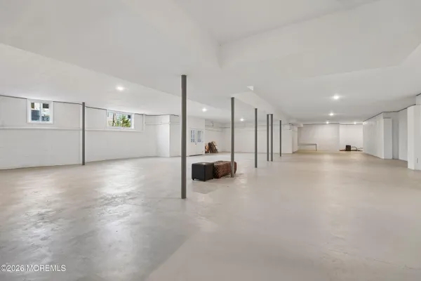 a view of a big room with closet and windows