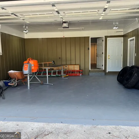 a living room with furniture a air conditioner vent and a window