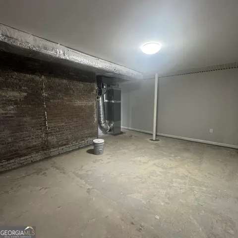 a house that has a big yard with wooden fence