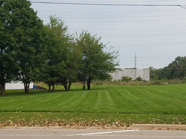 2760 Molitor Road Aurora, IL 60502 - Photo 1 of 2 a view of grassy field with benches