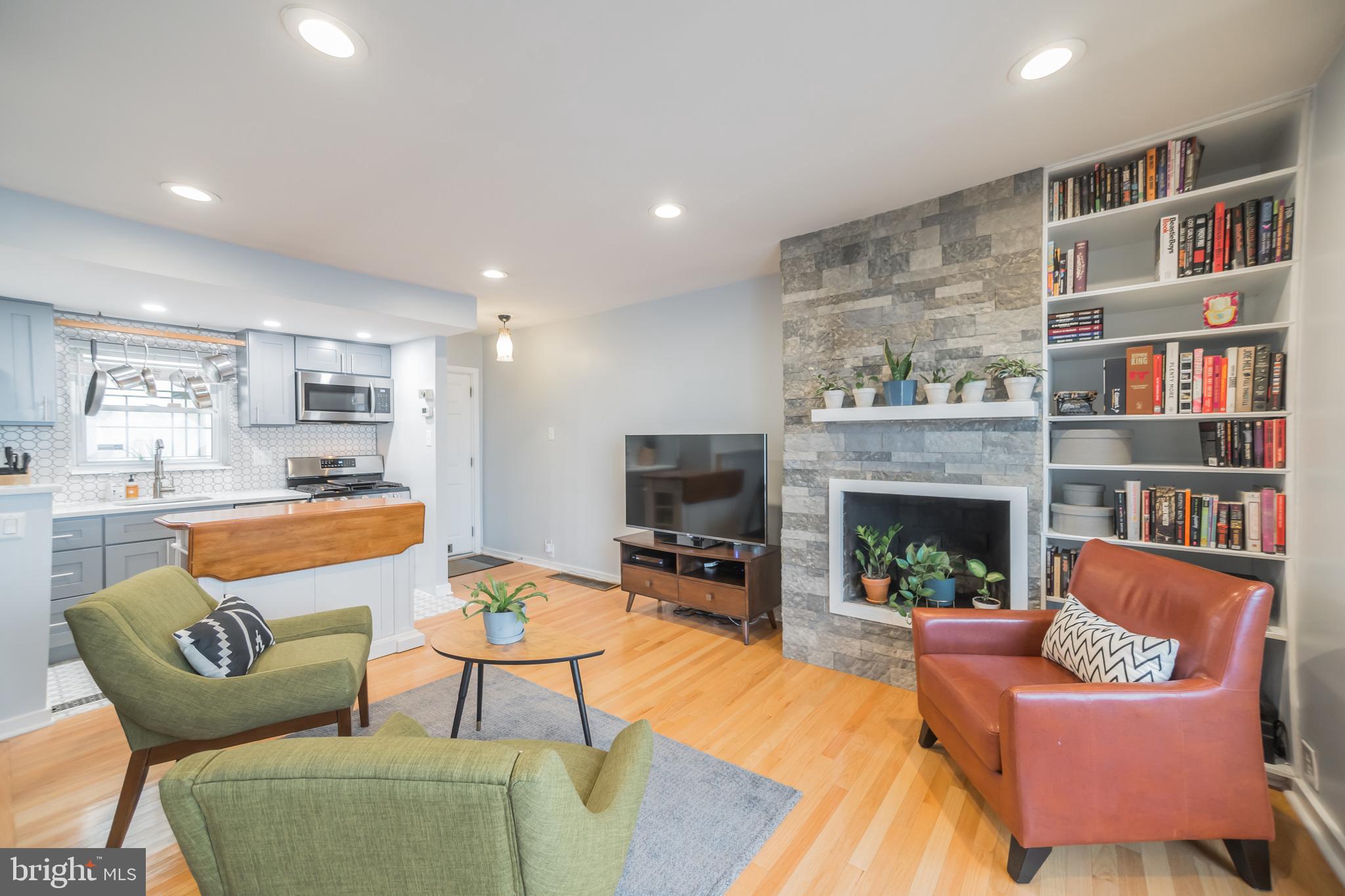 1032 Waverly Street Philadelphia, PA 19147 - Photo 2 of 30 a living room with furniture and a fireplace