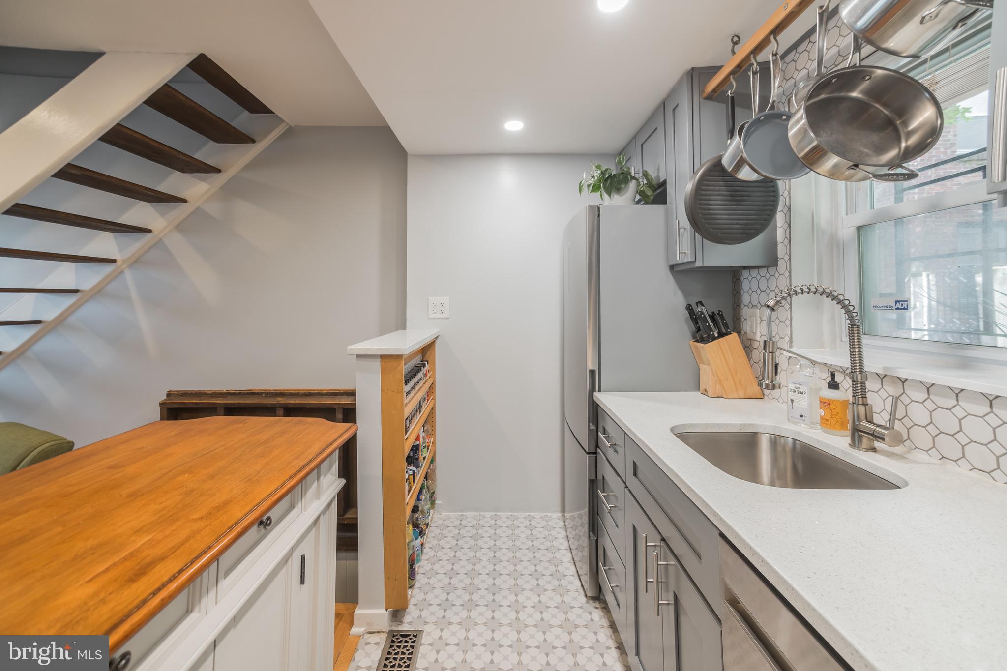1032 Waverly Street Philadelphia, PA 19147 - Photo 12 of 30 a kitchen with a sink and a stove top oven