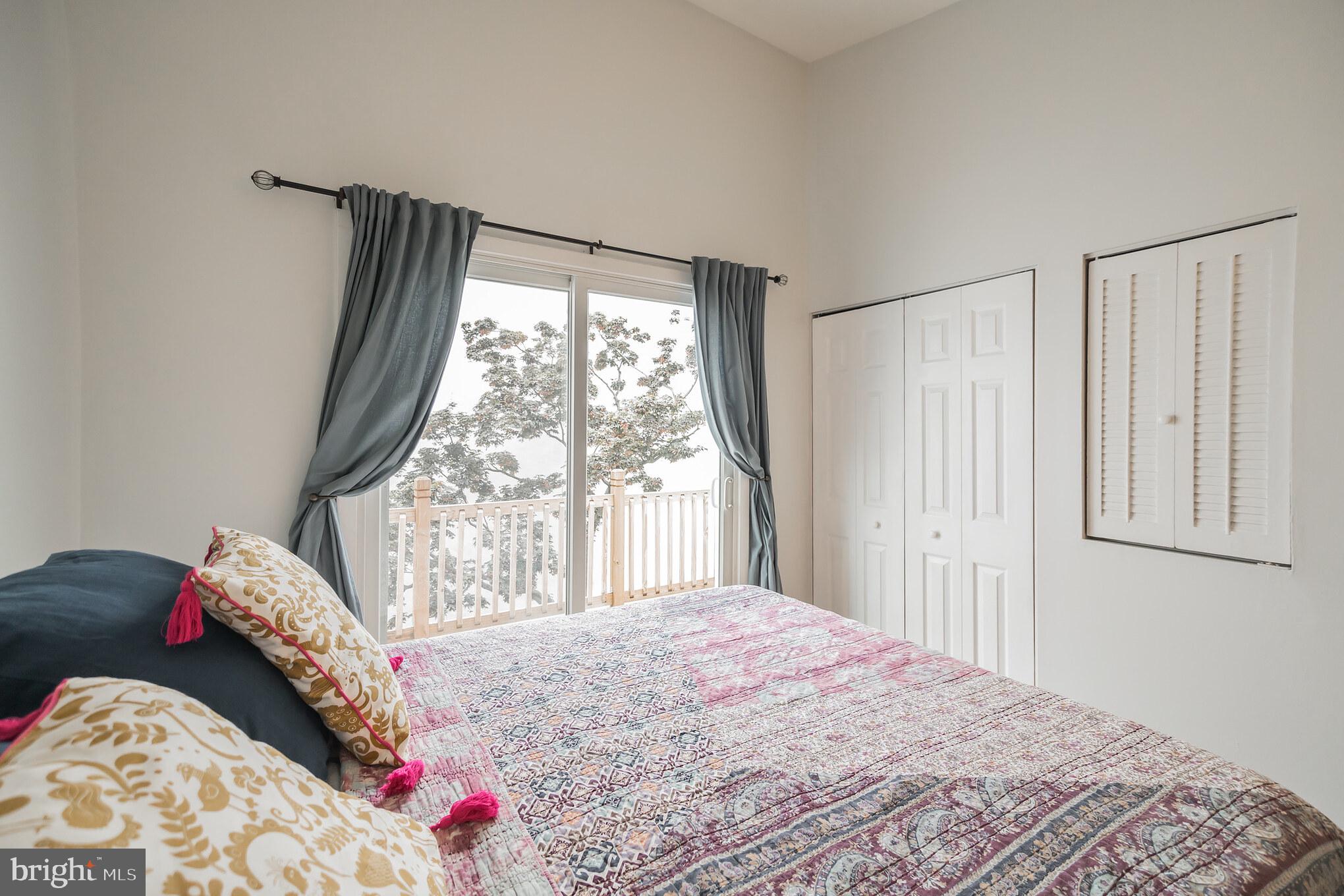1032 Waverly Street Philadelphia, PA 19147 - Photo 16 of 30 a bedroom with a bed and a large window