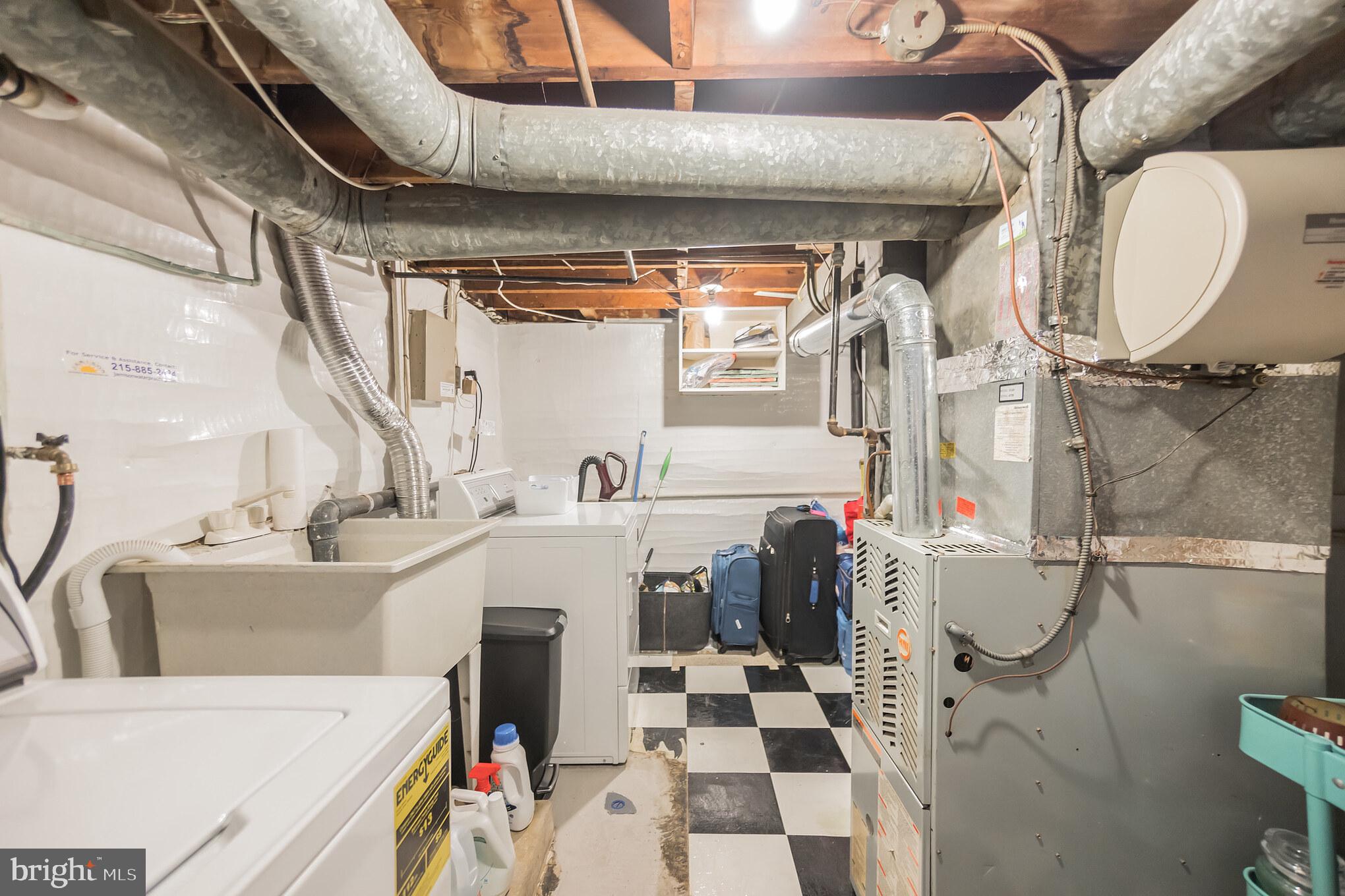 1032 Waverly Street Philadelphia, PA 19147 - Photo 28 of 30 a utility room with dryer and washer