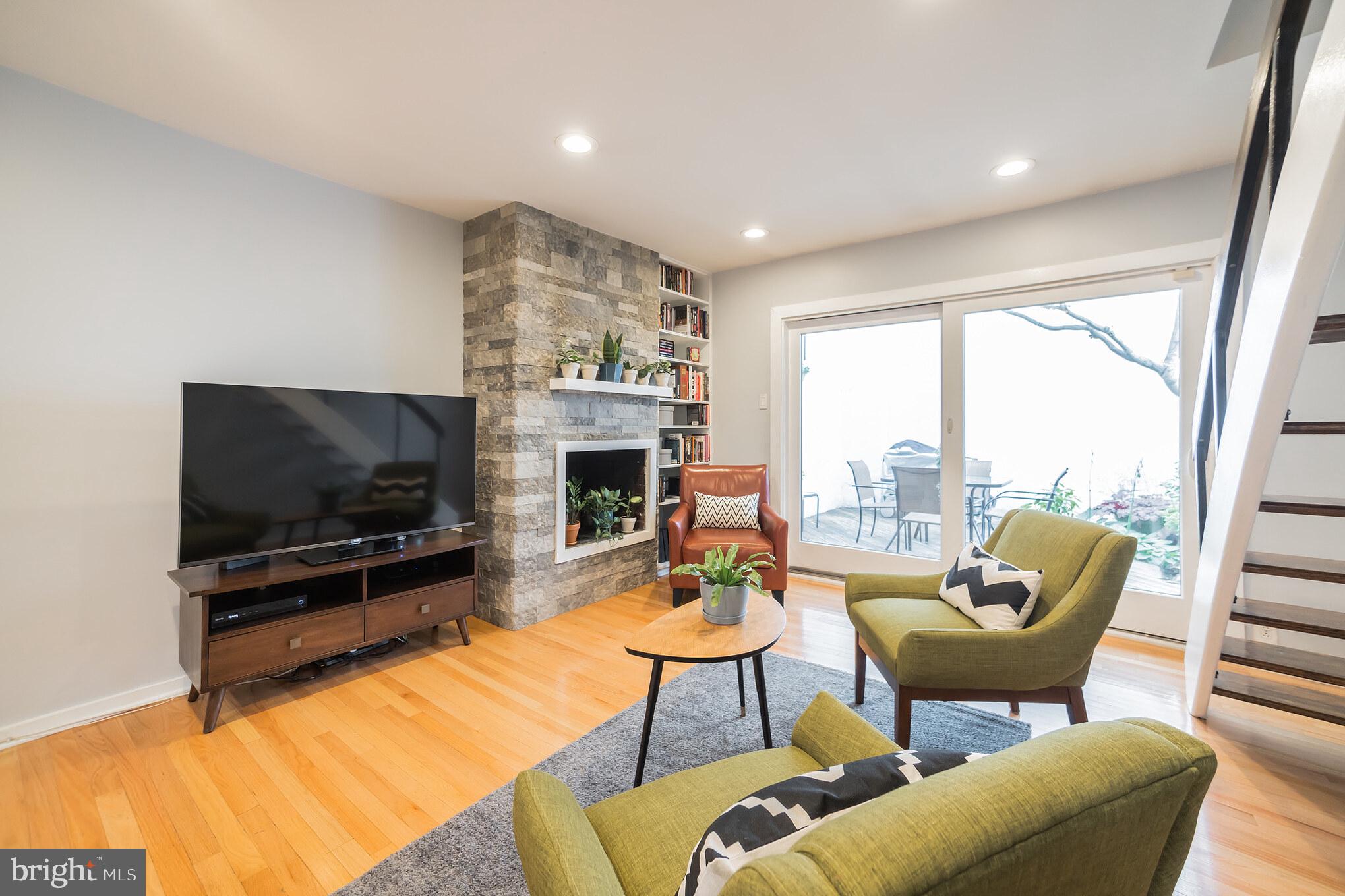 1032 Waverly Street Philadelphia, PA 19147 - Photo 7 of 30 a living room with furniture and a flat screen tv