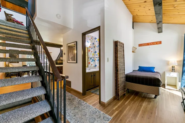 a bedroom with furniture and a window