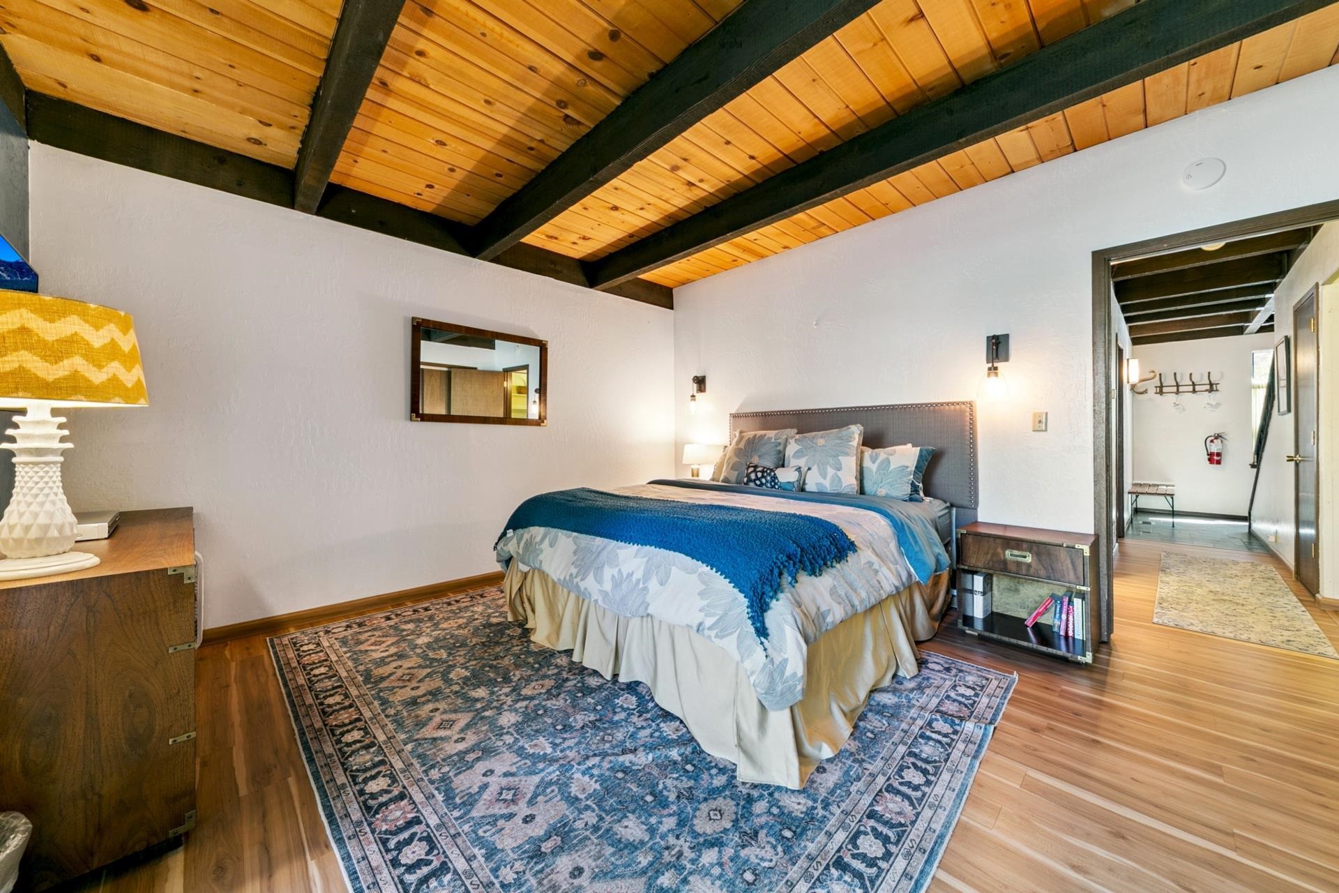 1001 Commonwealth Drive, Unit 114 Kings Beach, CA 96143 - Photo 14 of 23 a bedroom with bed and wooden floor