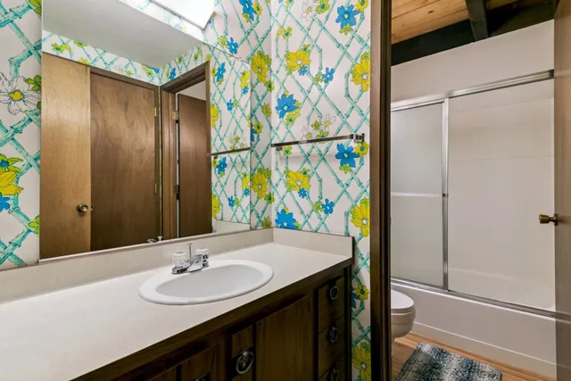 a bathroom with a sink and a mirror