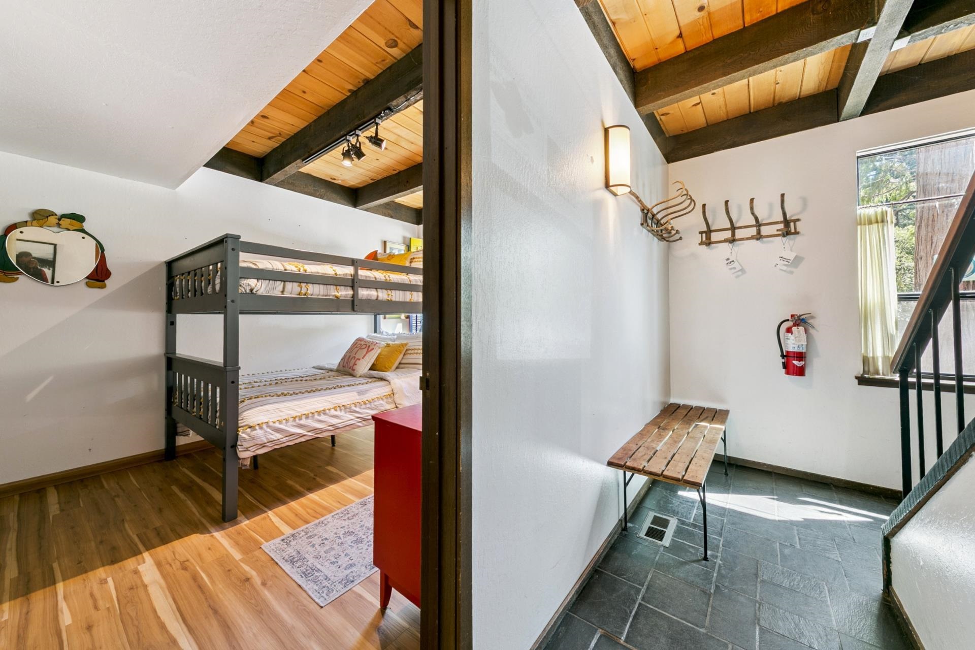 1001 Commonwealth Drive, Unit 114 Kings Beach, CA 96143 - Photo 17 of 23 a hallway with a table and a potted plant