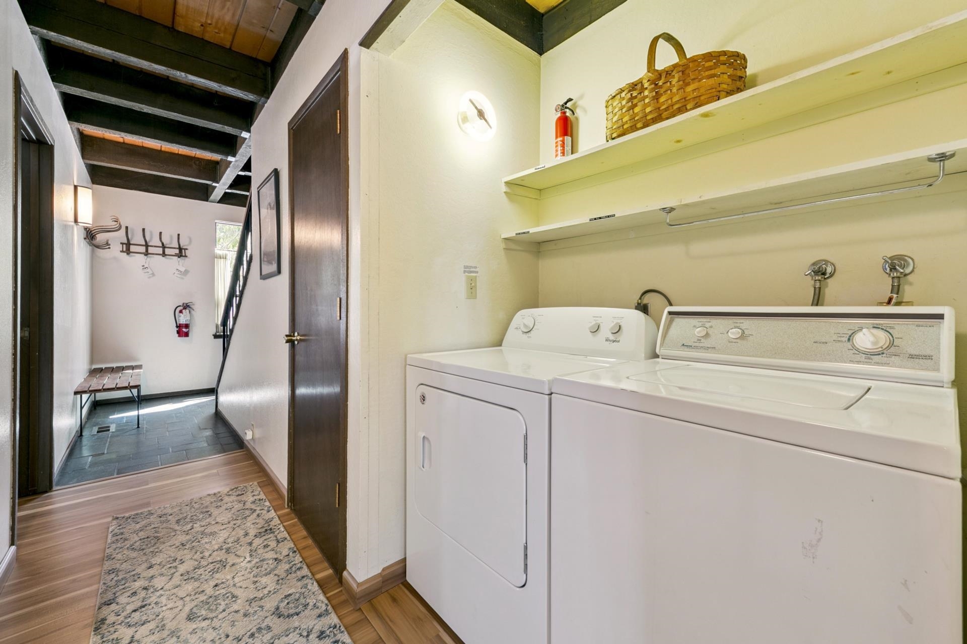1001 Commonwealth Drive, Unit 114 Kings Beach, CA 96143 - Photo 18 of 23 a utility room with dryer and washer