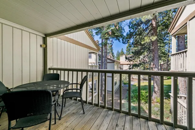 a view of a balcony with furniture