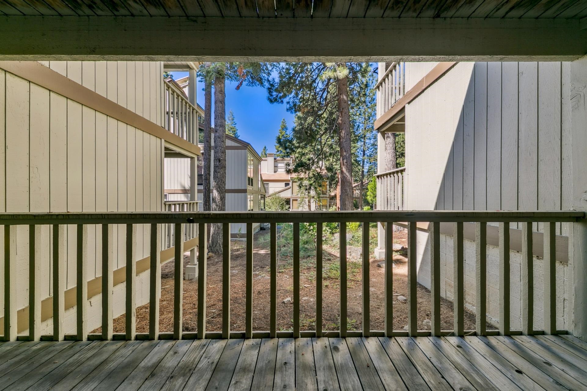 1001 Commonwealth Drive, Unit 114 Kings Beach, CA 96143 - Photo 20 of 23 a balcony with wooden floor and outdoor space