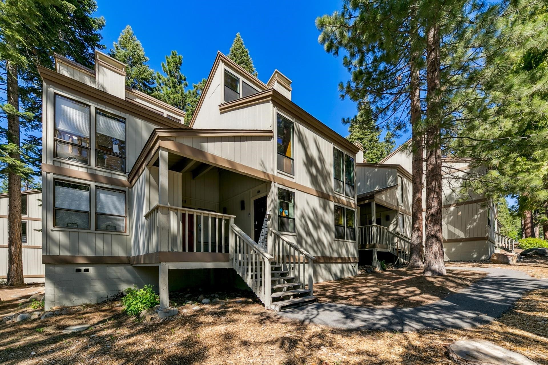 1001 Commonwealth Drive, Unit 114 Kings Beach, CA 96143 - Photo 2 of 23 a front view of a house with a yard