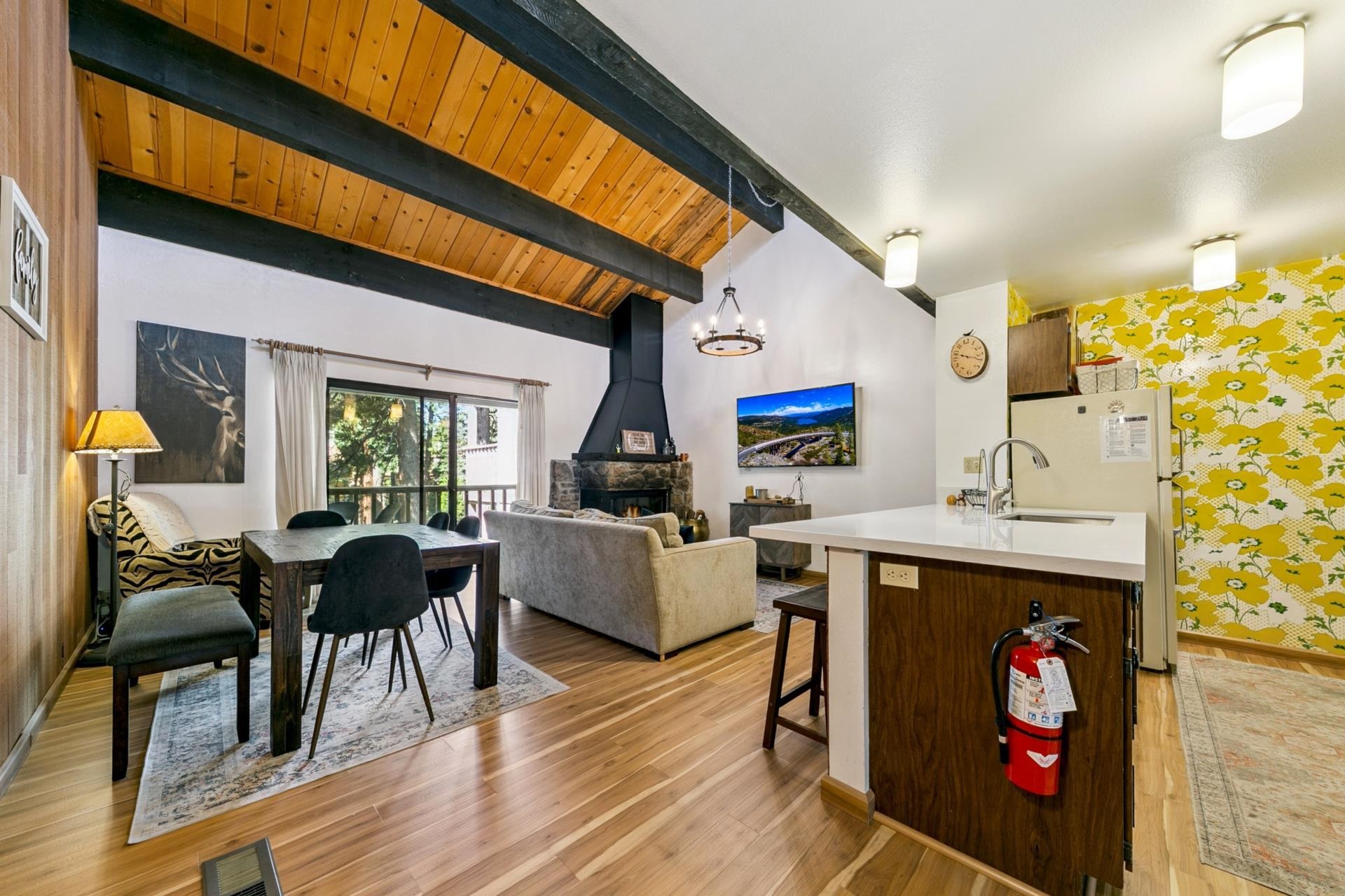1001 Commonwealth Drive, Unit 114 Kings Beach, CA 96143 - Photo 3 of 23 a living room with furniture and wooden floor