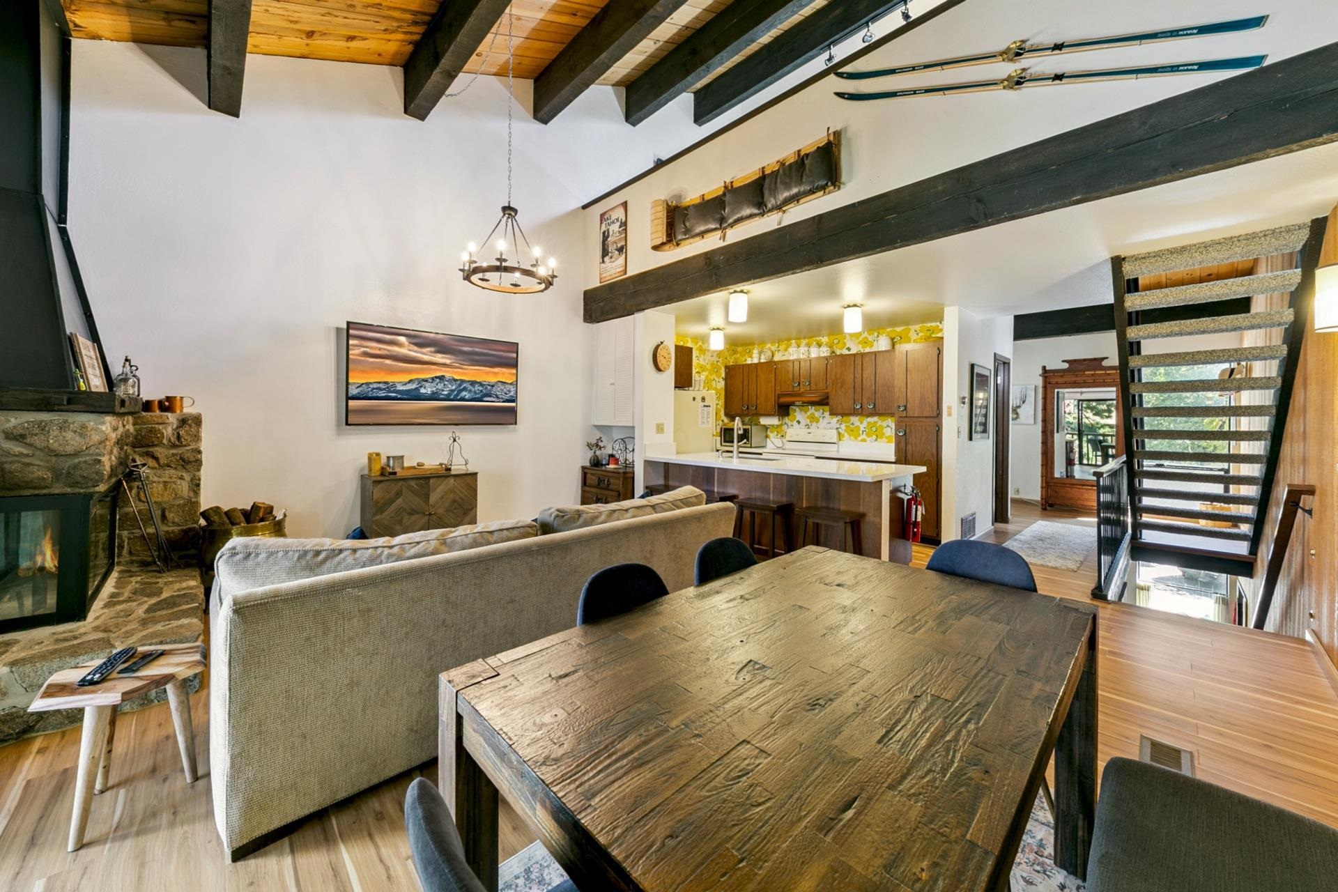 1001 Commonwealth Drive, Unit 114 Kings Beach, CA 96143 - Photo 6 of 23 a living room with furniture and a flat screen tv