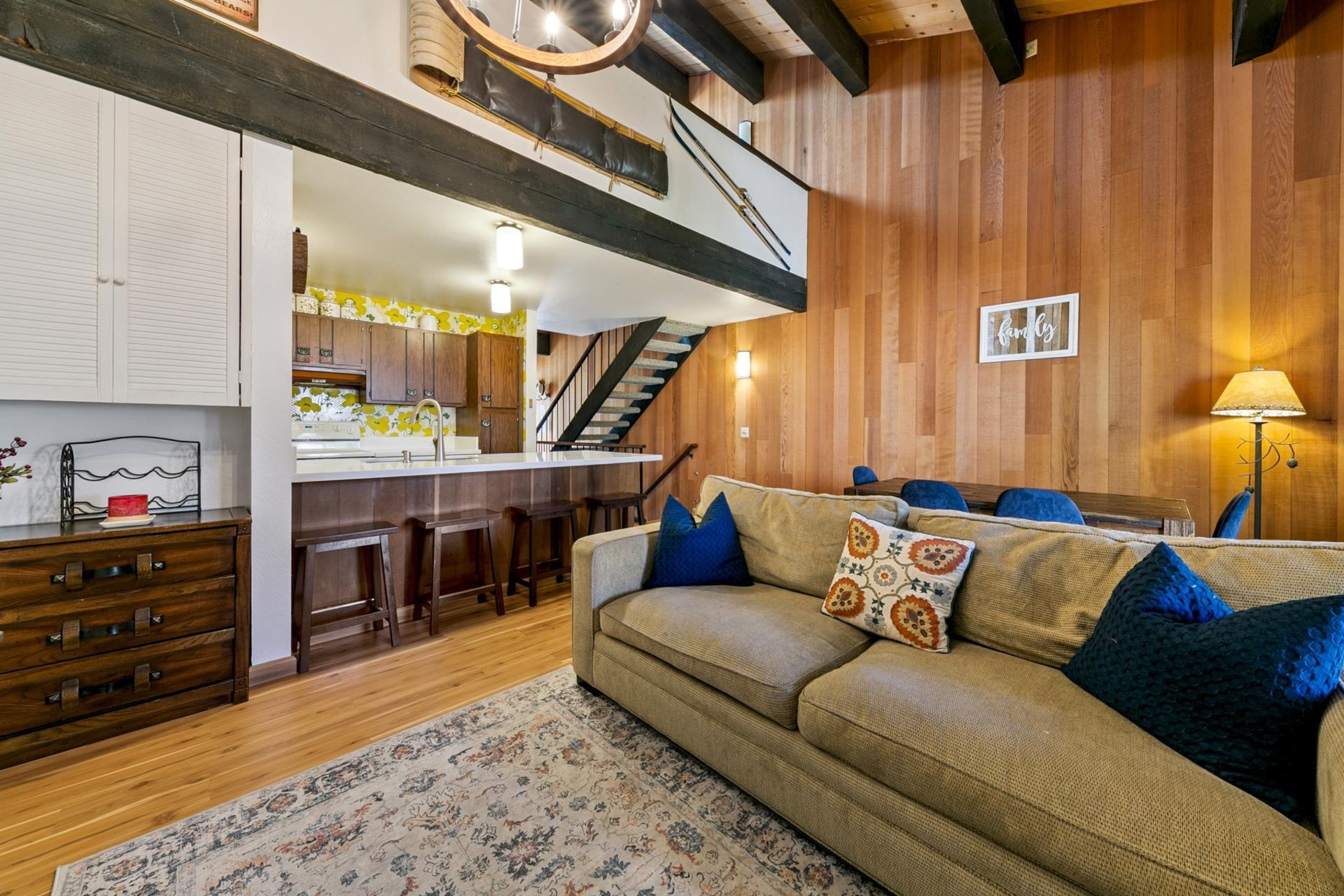 1001 Commonwealth Drive, Unit 114 Kings Beach, CA 96143 - Photo 7 of 23 a living room with furniture and a fireplace