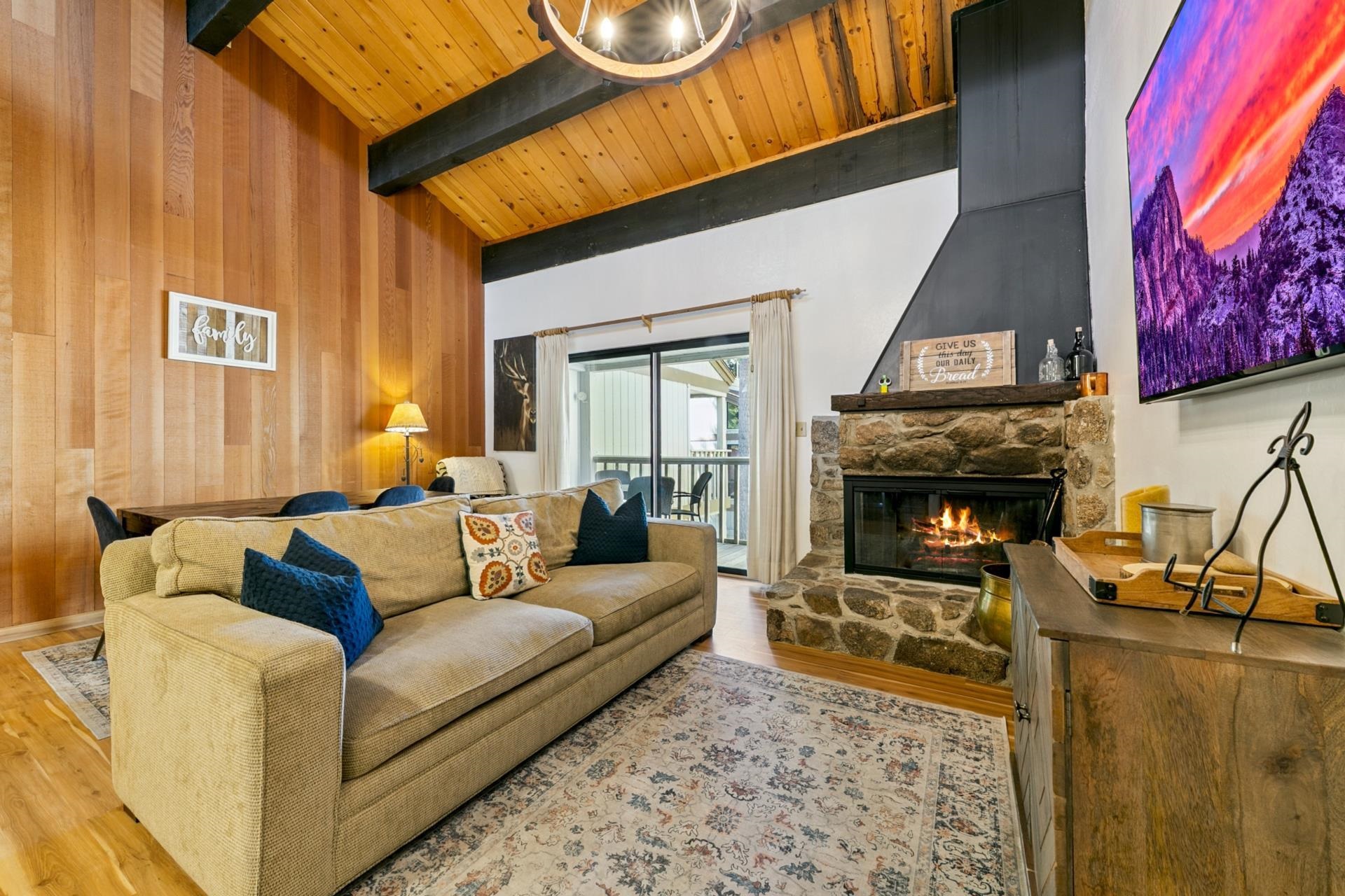 1001 Commonwealth Drive, Unit 114 Kings Beach, CA 96143 - Photo 8 of 23 a living room with furniture and a fireplace