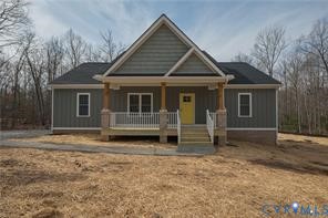 Craftsman-style home featuring gray siding with a