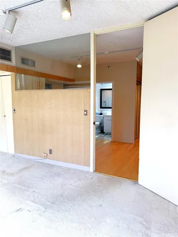 a view of hallway with livingroom