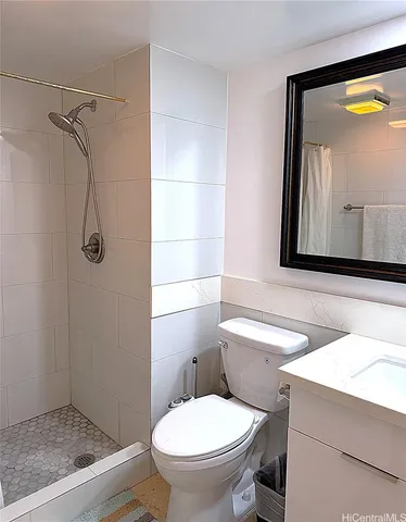 a bathroom with a toilet sink and shower