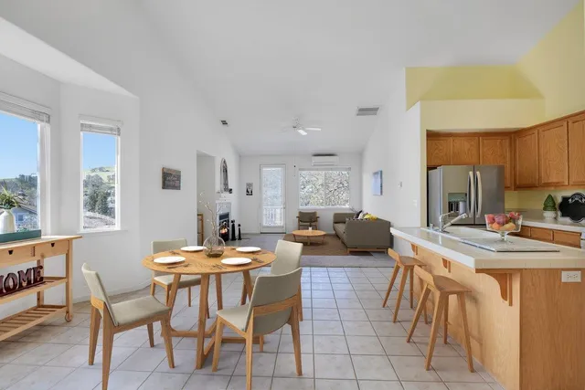 a kitchen with stainless steel appliances granite countertop a refrigerator sink stove and microwave