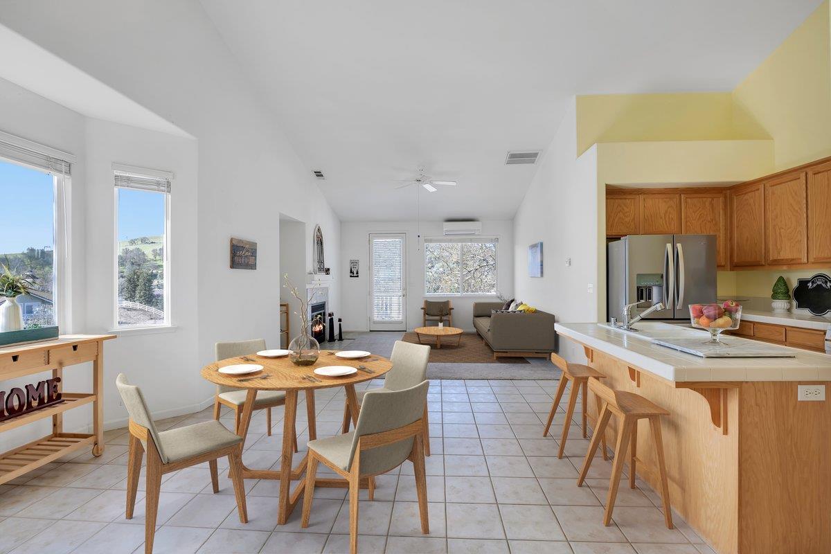 6250 Bluff View Road, Unit 60 Copperopolis, CA 95228 - Photo 13 of 75 a view of a dining room with furniture and a large window