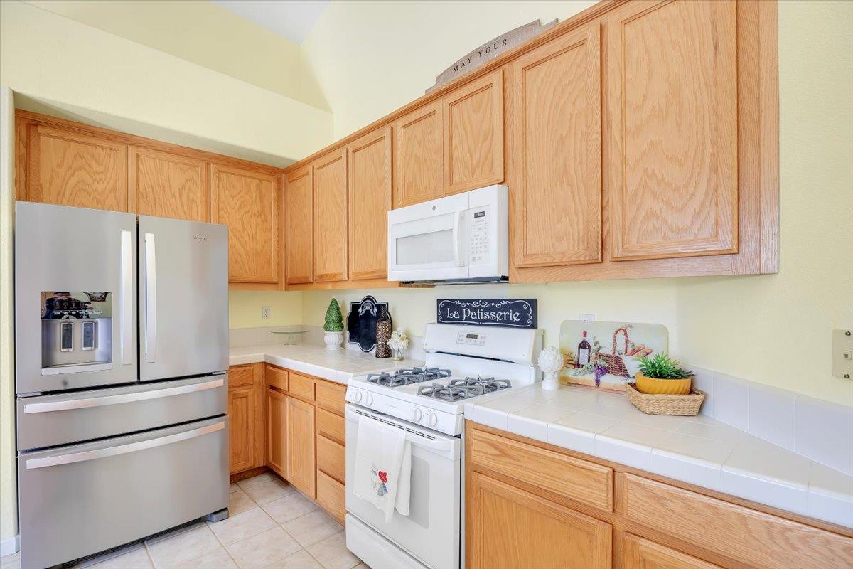 6250 Bluff View Road, Unit 60 Copperopolis, CA 95228 - Photo 15 of 75 a kitchen with appliances a sink and cabinets