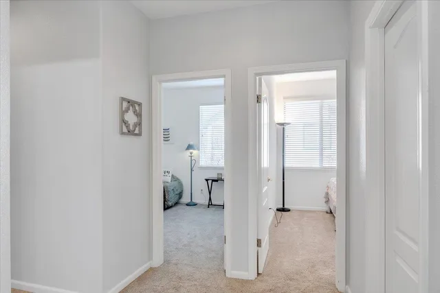 a bathroom with a granite countertop sink a toilet and a mirror