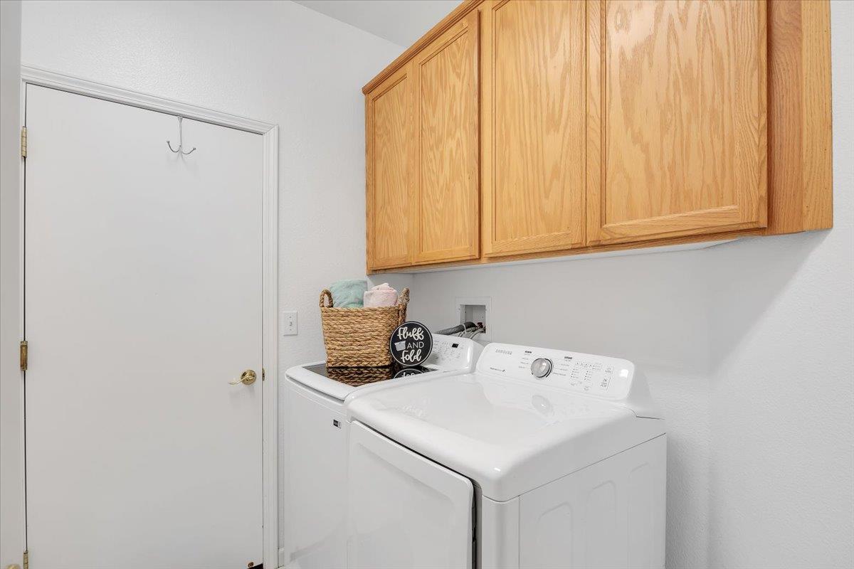 6250 Bluff View Road, Unit 60 Copperopolis, CA 95228 - Photo 27 of 75 a utility room with dryer and washer