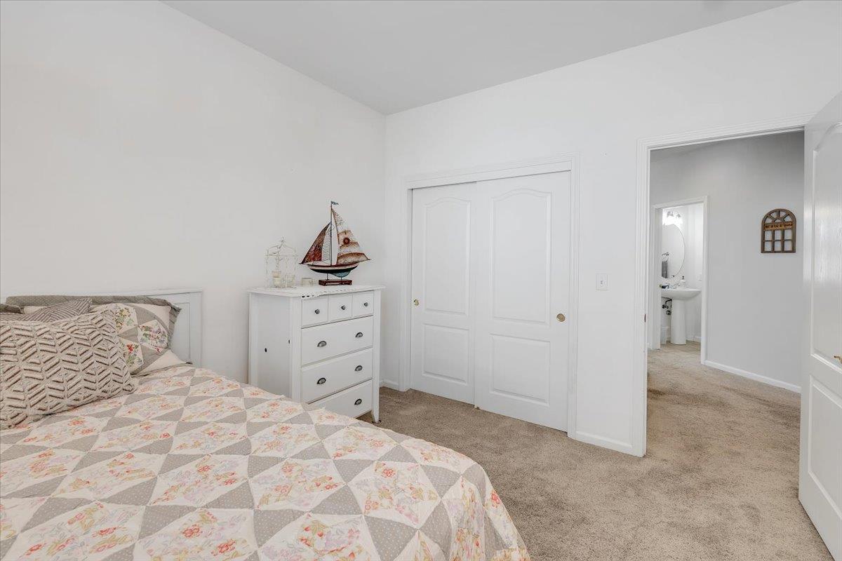 6250 Bluff View Road, Unit 60 Copperopolis, CA 95228 - Photo 29 of 75 a bedroom with a bed and a cabinets