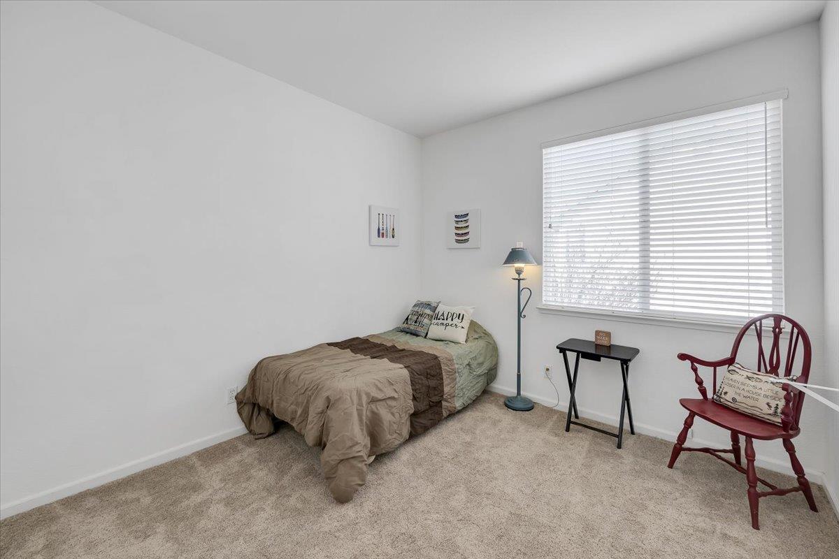 6250 Bluff View Road, Unit 60 Copperopolis, CA 95228 - Photo 30 of 75 a bedroom with a bed and a window
