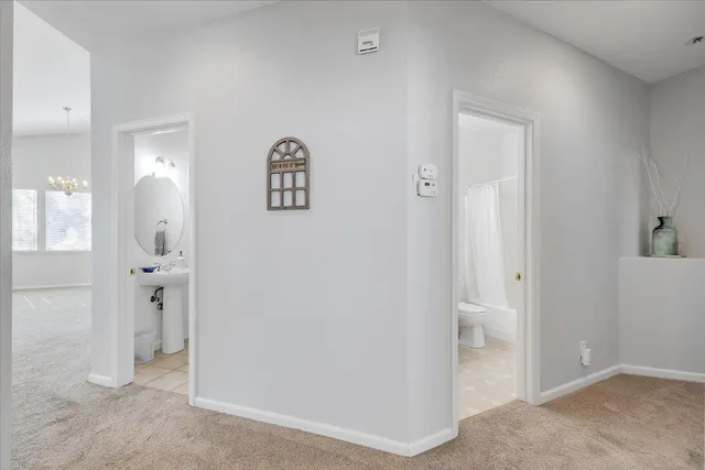 a bathroom with a sink double vanity and a mirror