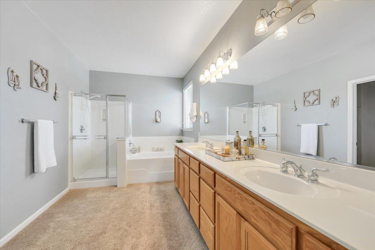 6250 Bluff View Road, Unit 60 Copperopolis, CA 95228 - Photo 37 of 75 a spacious bathroom with a double vanity sink mirror double and shower
