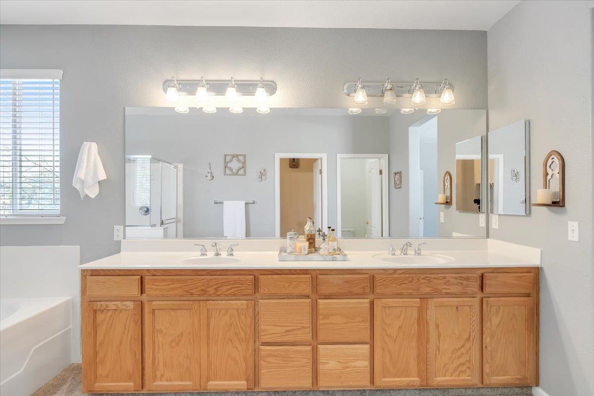 6250 Bluff View Road, Unit 60 Copperopolis, CA 95228 - Photo 40 of 75 a bathroom with a sink double vanity and a mirror