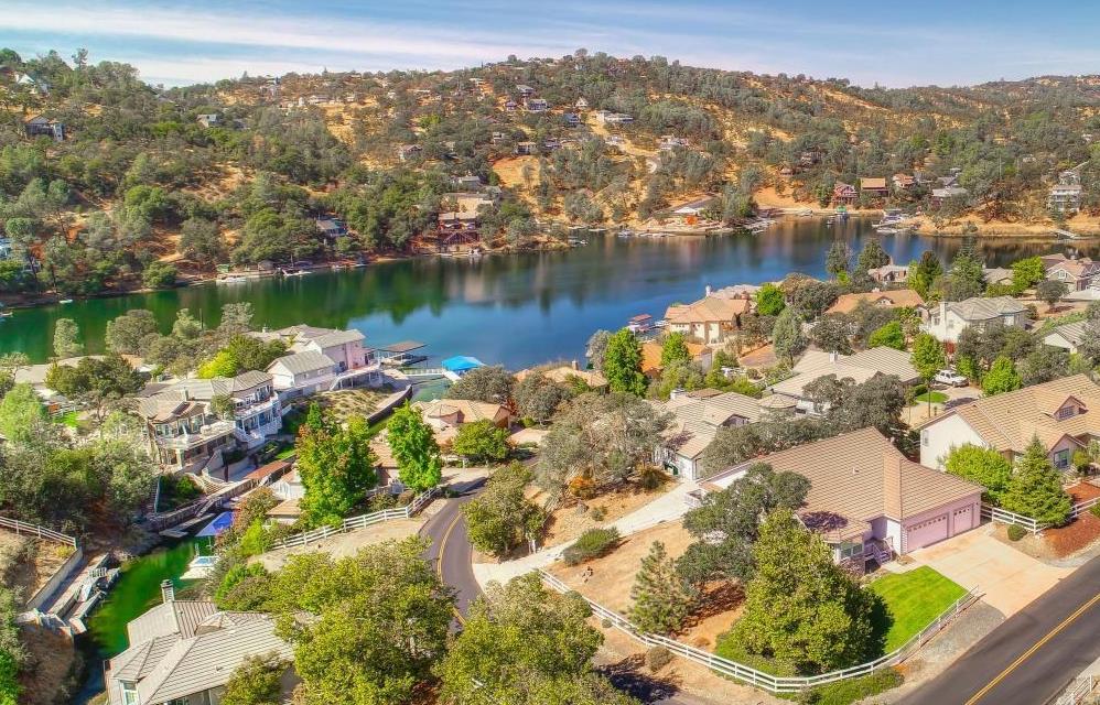 6250 Bluff View Road, Unit 60 Copperopolis, CA 95228 - Photo 45 of 75 an aerial view of lake residential house with outdoor space and trees all around
