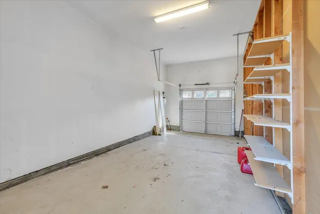 an aerial view of residential houses and lake view