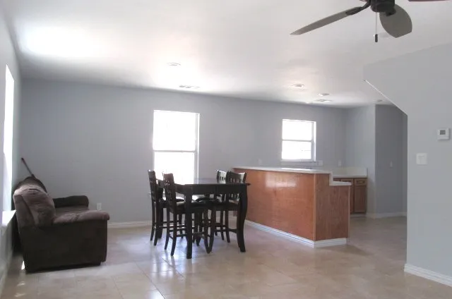 a view of a livingroom with furniture and window