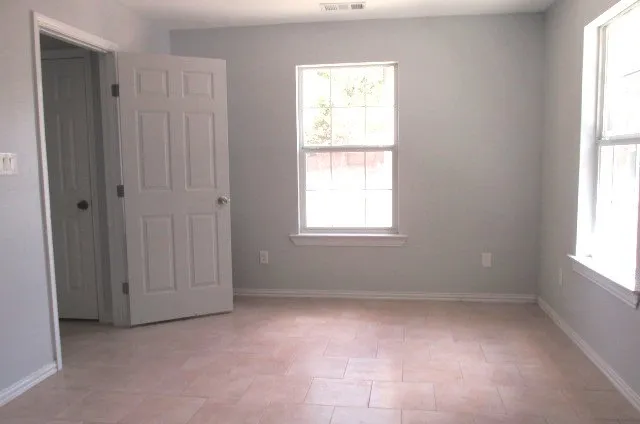 an empty room with windows