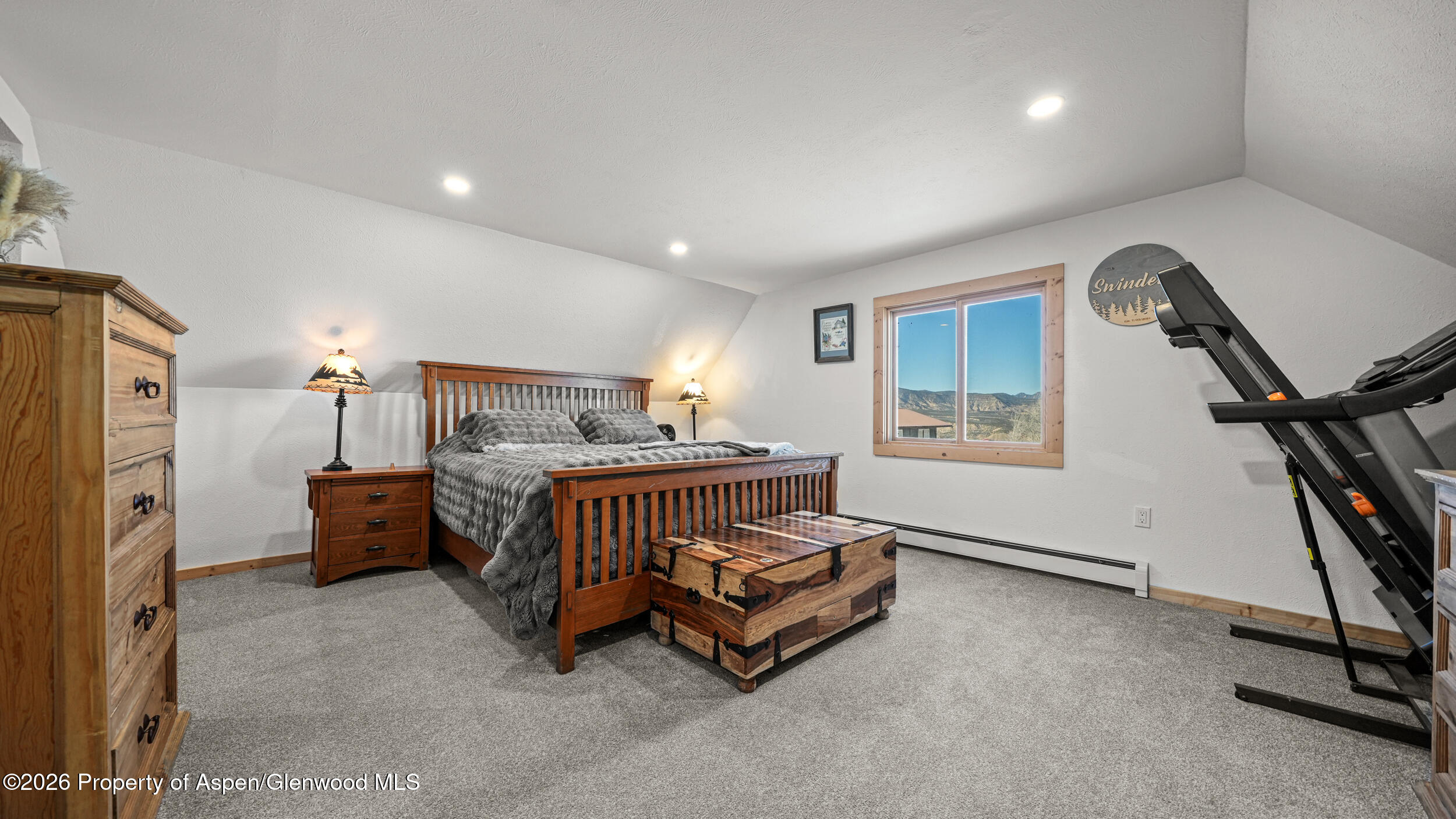 9109 County Road 320 Rifle, CO 81650 - Photo 15 of 38 a bedroom with furniture and a window