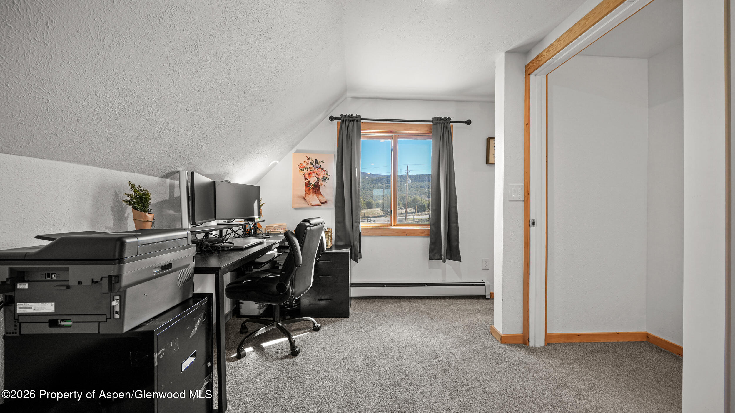 9109 County Road 320 Rifle, CO 81650 - Photo 17 of 38 a view of a workspace with furniture