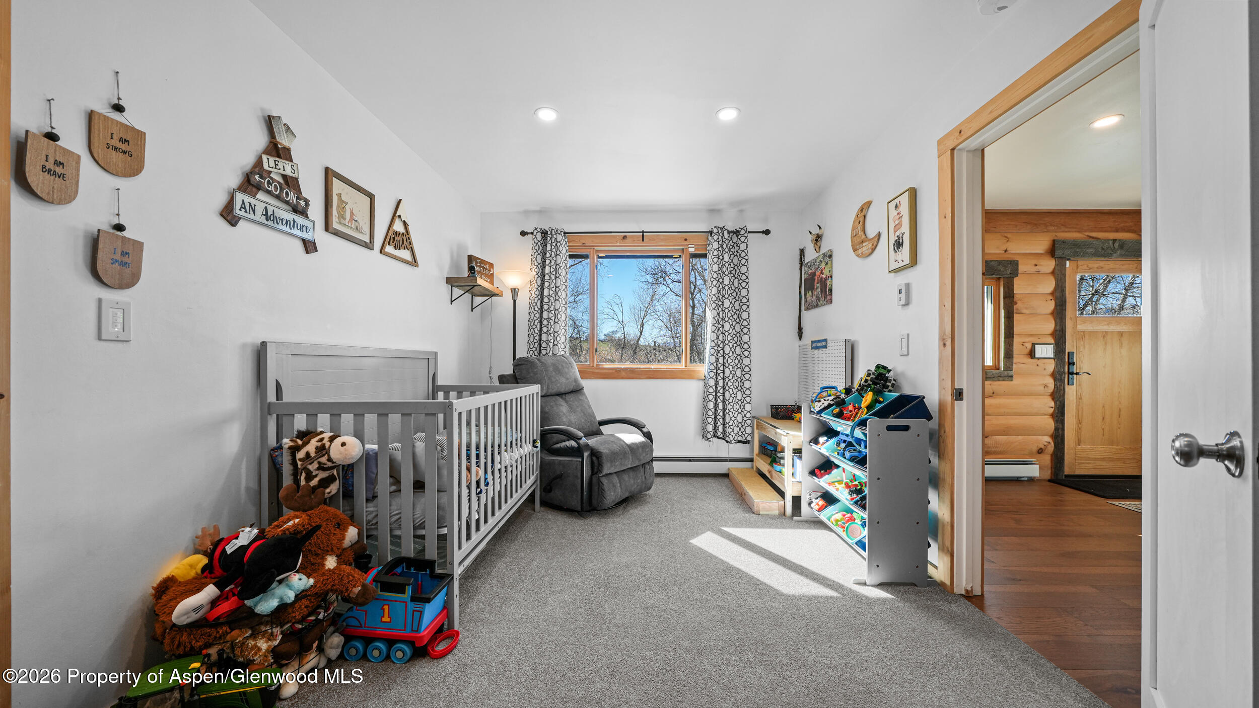 9109 County Road 320 Rifle, CO 81650 - Photo 21 of 38 a bedroom with furniture and a gym equipment