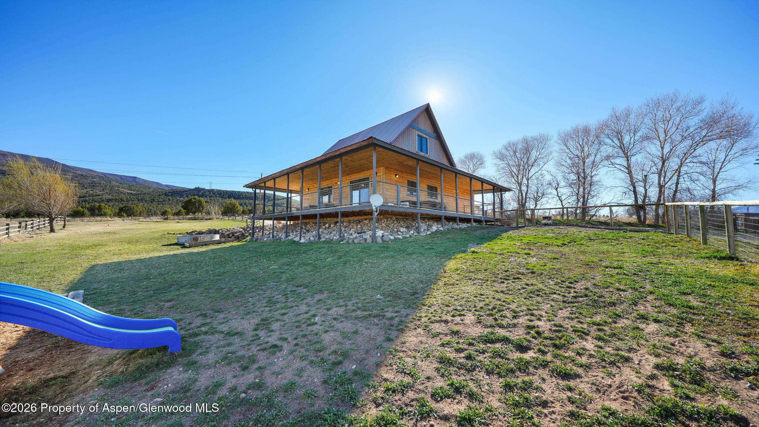 9109 County Road 320 Rifle, CO 81650 - Photo 25 of 38 a view of a house with a yard