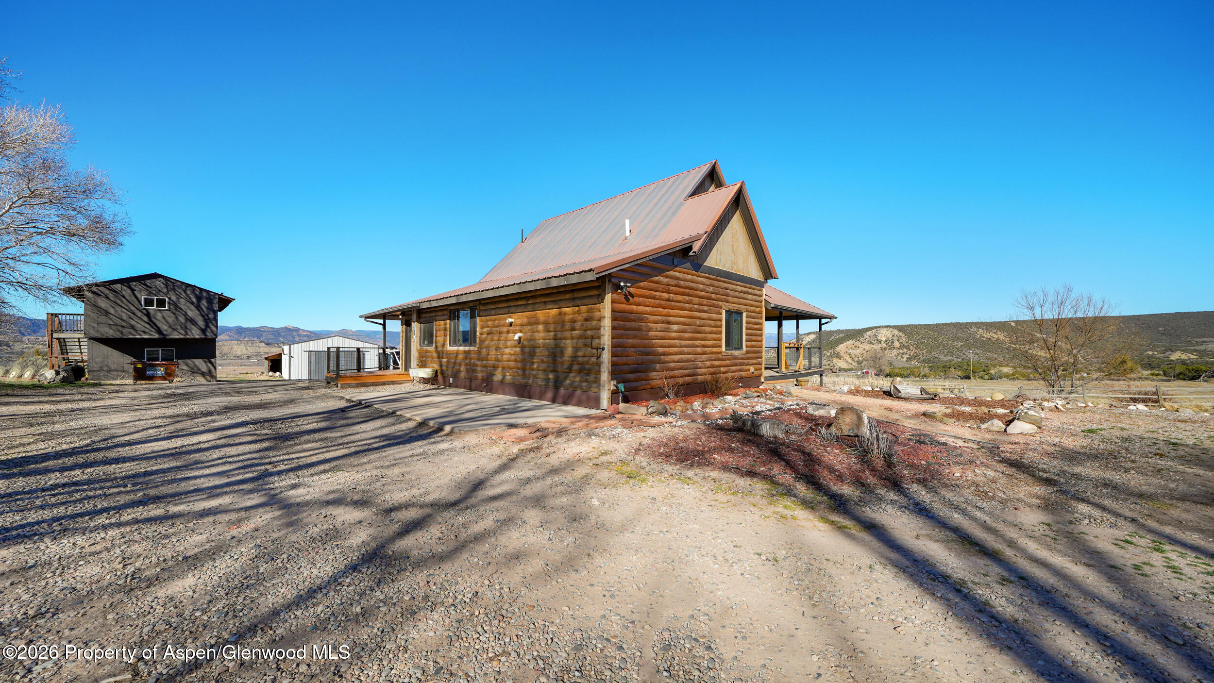 9109 County Road 320 Rifle, CO 81650 - Photo 27 of 38 a view of a house with a yard