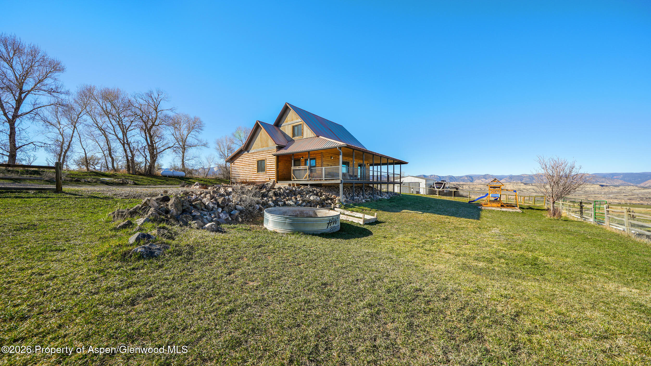 9109 County Road 320 Rifle, CO 81650 - Photo 3 of 38 a house view with a garden space